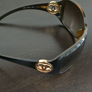 CHANEL Women's Sunglasses in Black with Gold Accents